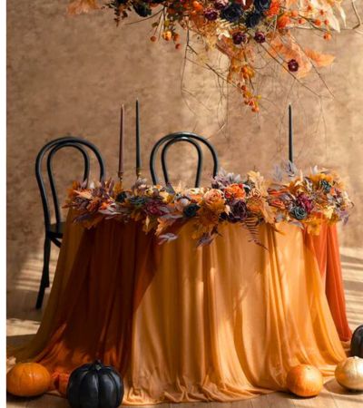 black and orange color scheme with pumpkins and candles