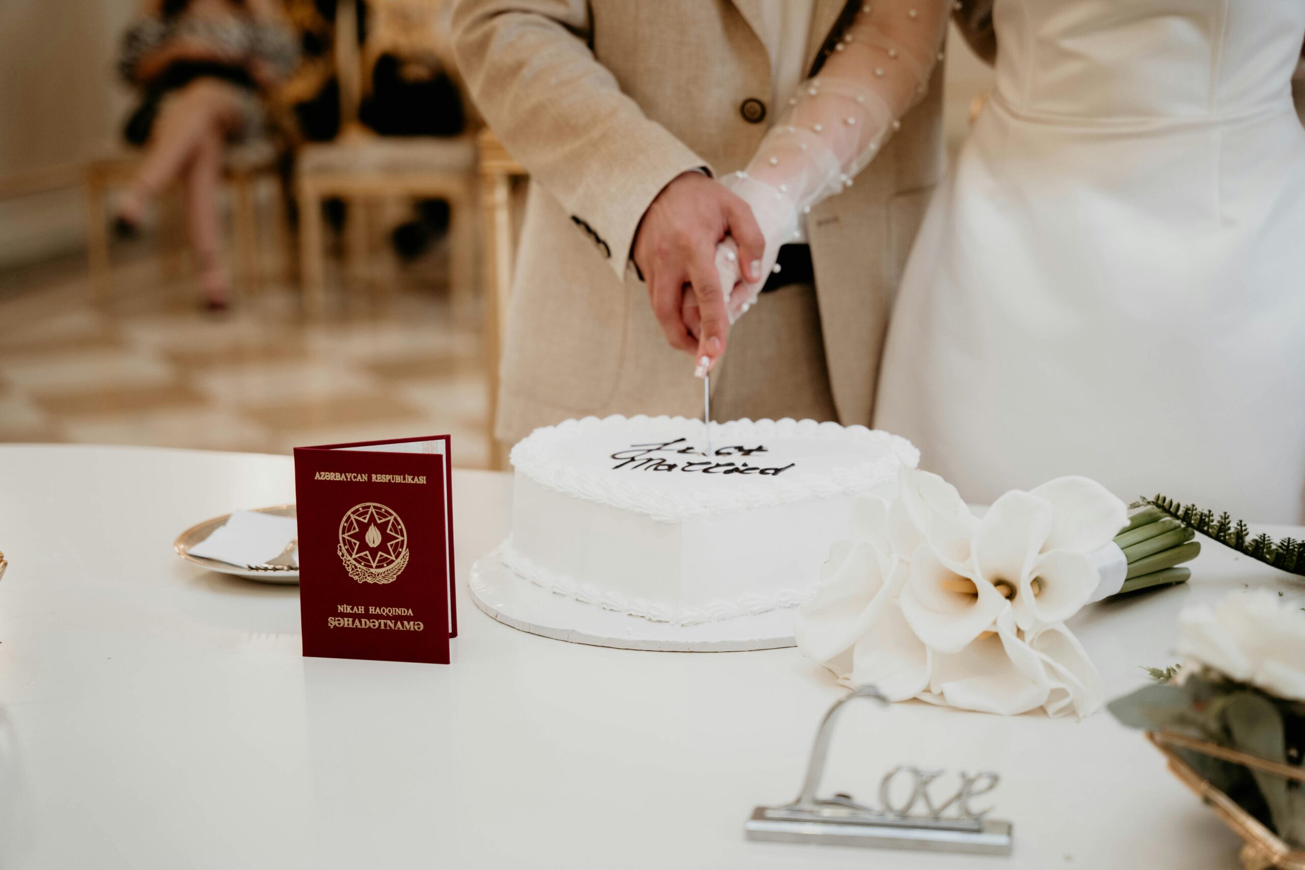 bride cutting traditional wedding cake